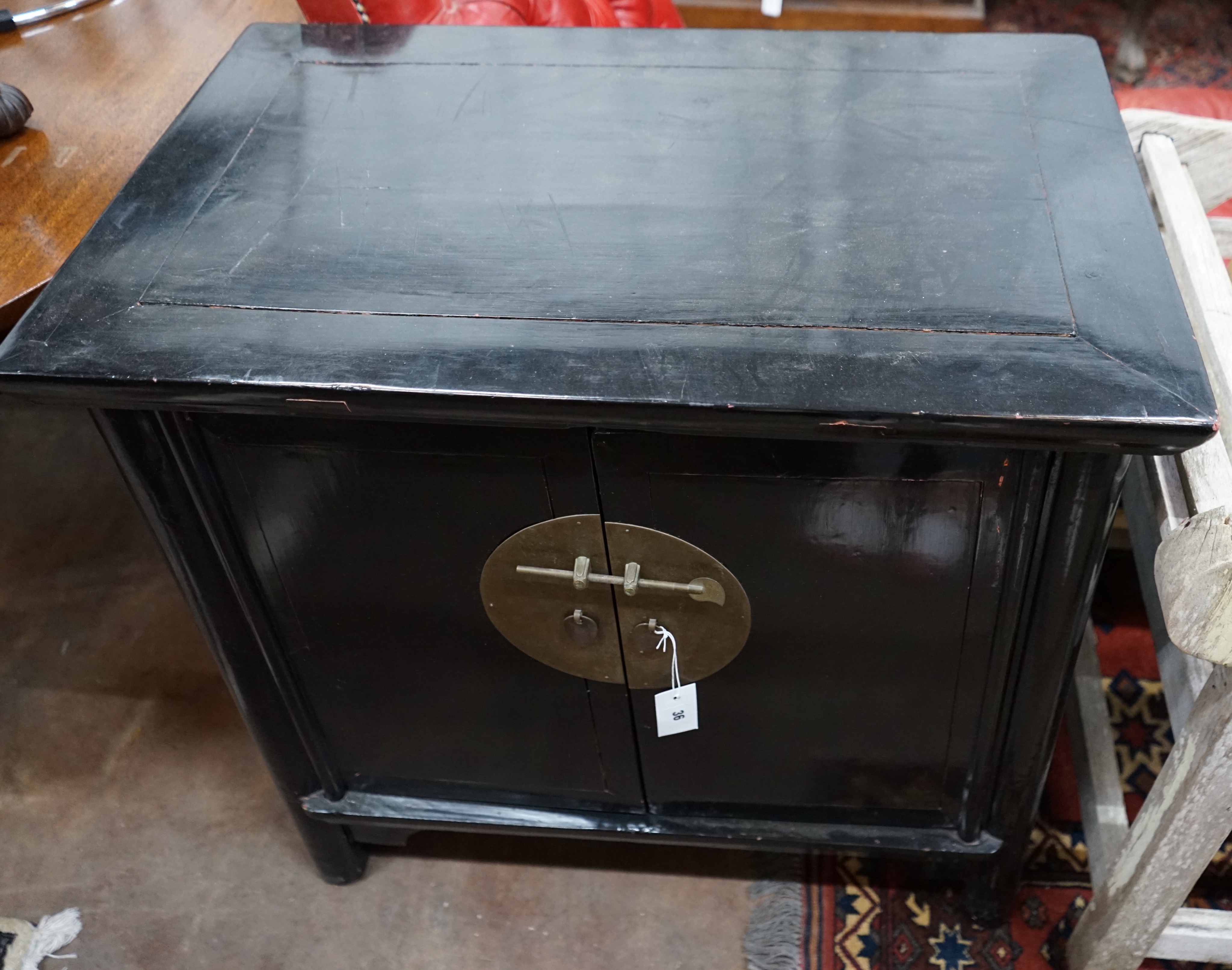A Chinese lacquer two door side cabinet, width 78cm depth 50cm height 79cm